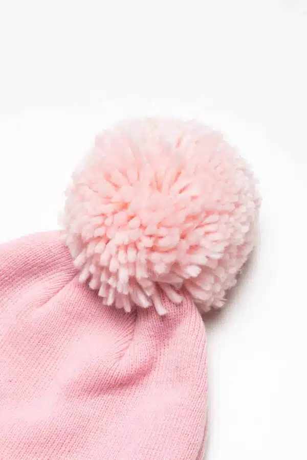 hype pale pink bobble hat close up of bobble