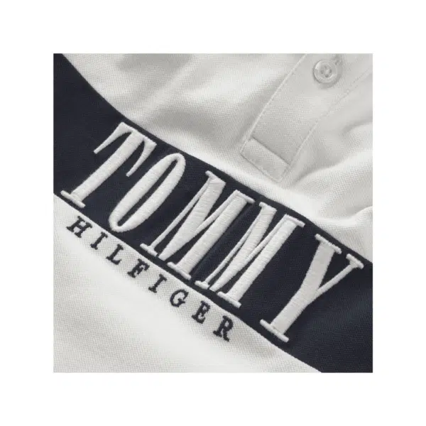 Tommy Hilfiger boys white polo shirt close up of logo