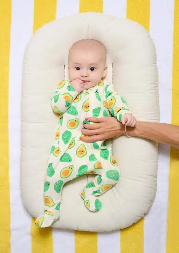 the bonnie mob avocado babygro on model