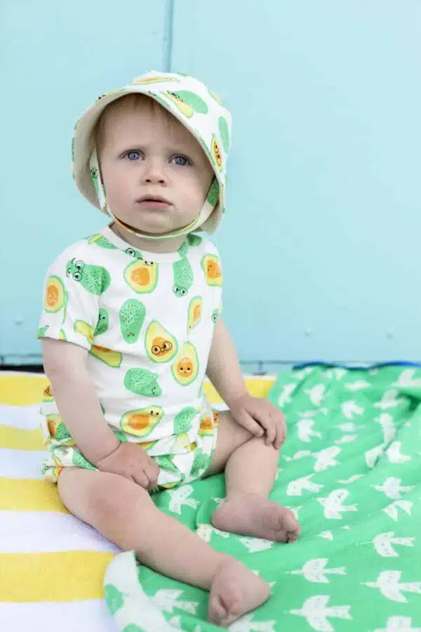 The Bonnie mob avocado baby set on sitting model