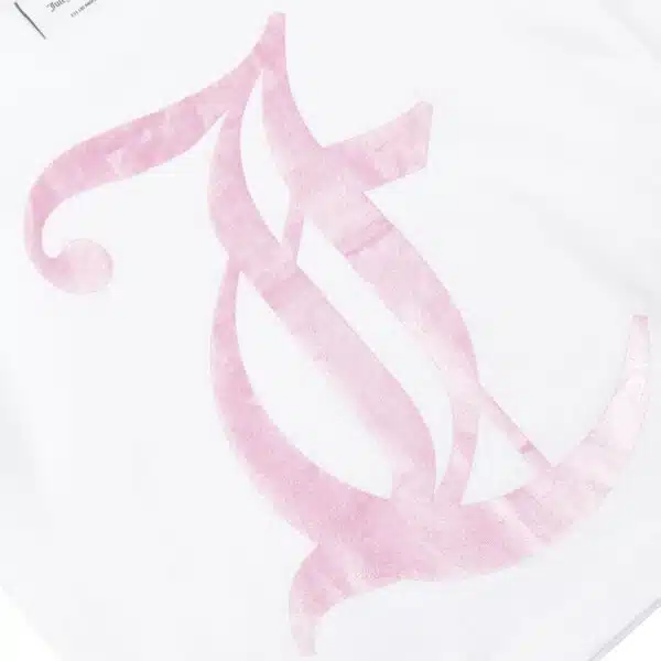 Juicy Couture pale pink logo close up on tshirt