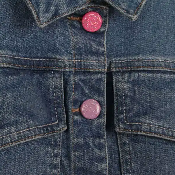 Billieblush model with unicorn denim jacket close up