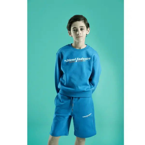 Diesel boys blue sweater and shorts on model