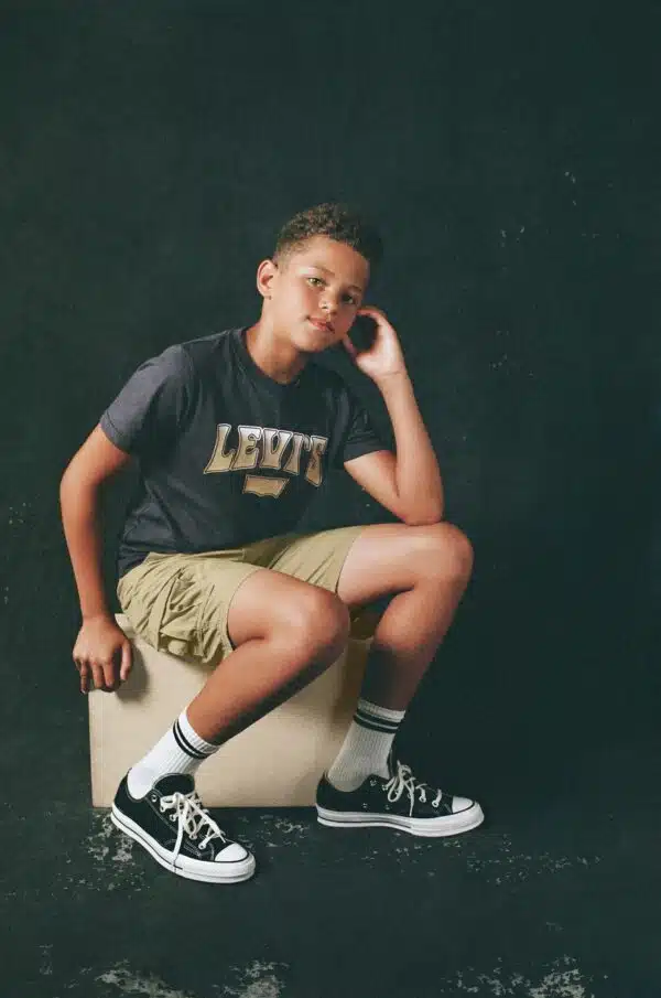 Levi's navy tshirt on seated model