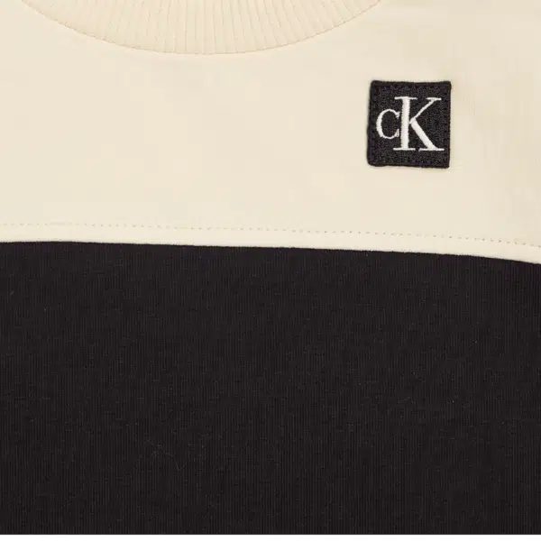 calvin klein baby toddler cream and black tracksuit logo close up