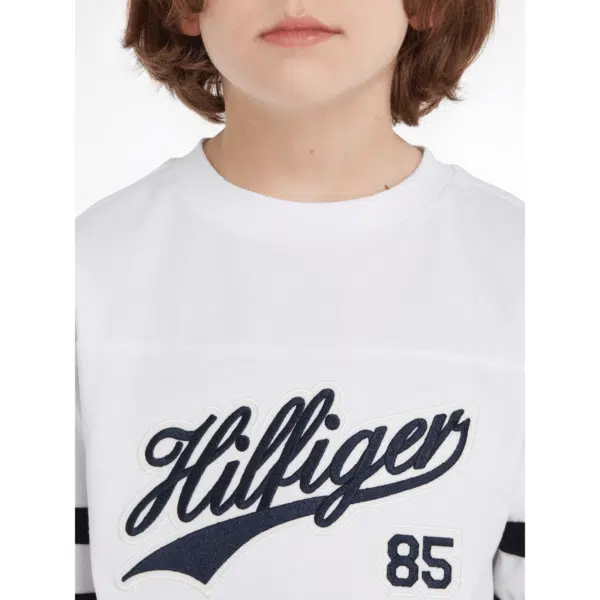 tommy hilfiger boys script long sleeved white tshirt close up on model